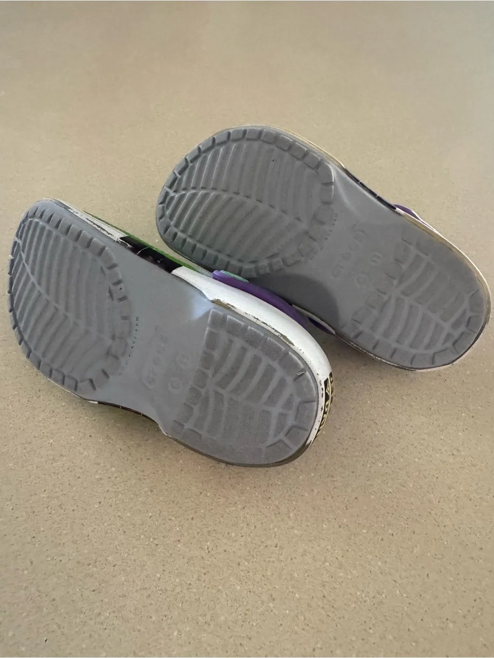 CROCS Kids Green Clogs with Purple Heel Strap and Space Charms